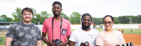 Recent MGA media & communication majors during their photography/videography internships with the Macon Bacon baseball team.